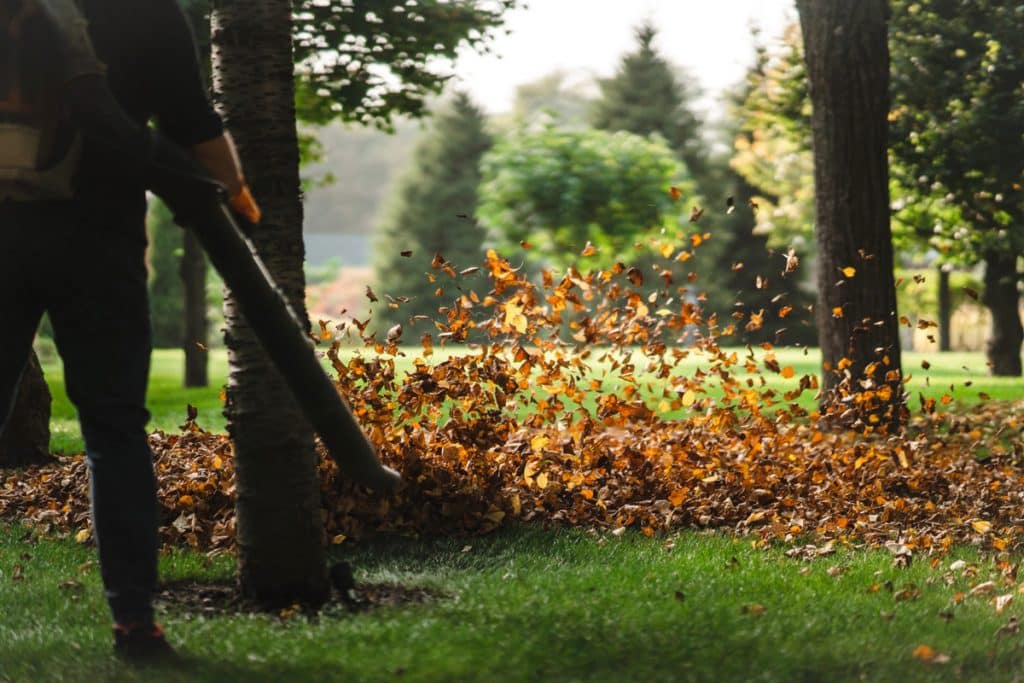 A Man Operating A Heavy Duty Leaf Blower